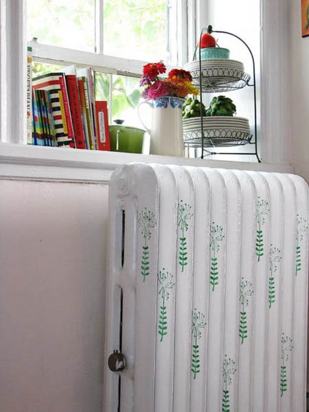 green leaf patterns on white cast iron radiator